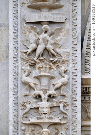 Relief on the portal of the Cathedral of Saint Lawrence in Lugano, Switzerland Relief on the portal of the Cathedral of Saint Lawrence in Lugano, Switzerland 109198539