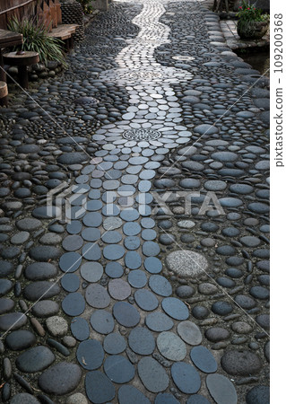 The characteristic Gujo Hachiman Yanaka Mizu Komichi paved with cobblestones The characteristic Gujo Hachiman Yanaka Mizu Komichi paved with cobblestones 109200368