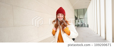 Young tourist, happy girl walking around european city with backpack, student goes to university, goes somewhere in town Young tourist, happy girl walking around european city with backpack, student goes to university, goes somewhere in town 109200671