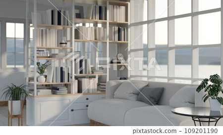 Image of cozy white modern living room with sofa and bookshelf with large window. 109201190