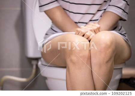 Asian woman urinating in toilet,problem of Polyuria,urination disorders,frequent micturition,urinary incontinence,urinary urgency,overactive bladder,urine frequency,kidney and urinary bladder system Asian woman urinating in toilet,problem of Polyuria,urination disorders,frequent micturition,urinary incontinence,urinary urgency,overactive bladder,urine frequency,kidney and urinary bladder system 109202125