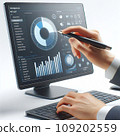 employee hand with pen pointing on screen with pie chart and diagrams 109202559