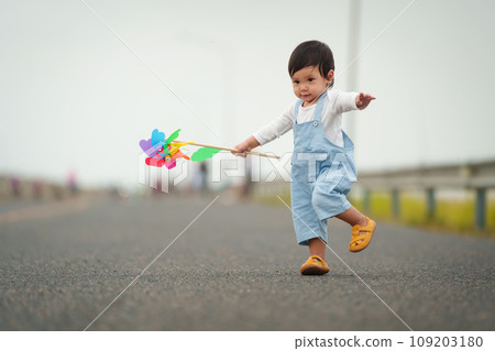 infant baby learning to walking first step on pathway infant baby learning to walking first step on pathway 109203180