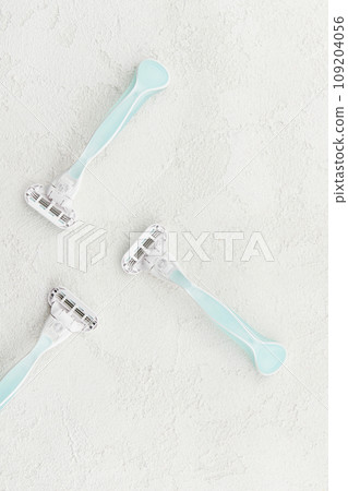 High-quality razor showcased on a sophisticated white backdrop. Grooming routine with style and precision High-quality razor showcased on a sophisticated white backdrop. Grooming routine with style and precision 109204056