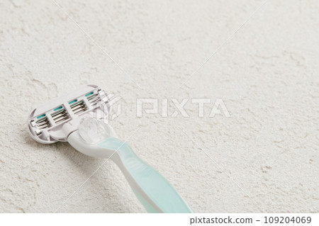 High-quality razor showcased on a sophisticated white backdrop. Grooming routine with style and precision 109204069