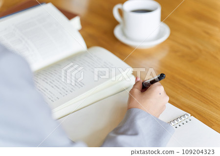 Business woman studying for qualifications Business woman studying for qualifications 109204323