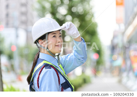 Asian woman working as a security guard 109204330