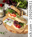 Vegan burgers with microgreens, berries and tofu. Close-up, selective focus. 109204631