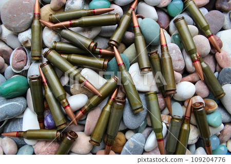 Pattern Of Scattered Bullets On A Round Smooth Rocks Top View Pattern Of Scattered Bullets On A Round Smooth Rocks Top View 109204776