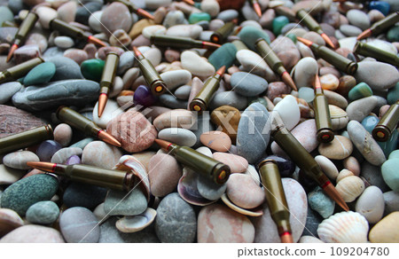 Bullets Scattered On A Pebble Stones Texture Background Stock Photo 109204780
