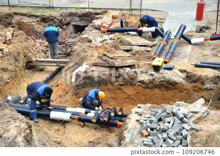 workers restore the destroyed pipeline, water supply accident, repair of the water supply system, restoration of the destroyed water supply, selective focus,  copy space 109206746