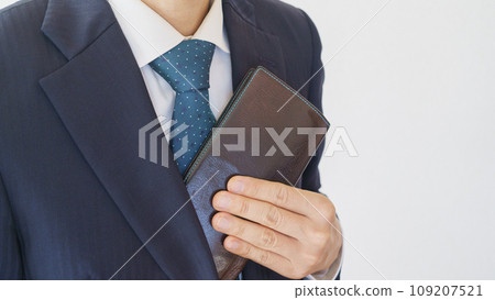 Businessman taking out his wallet Businessman taking out his wallet 109207521