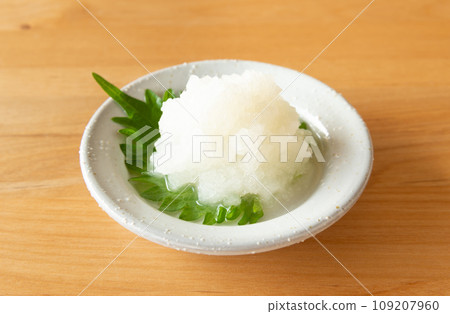 Grated radish on a small plate Grated radish on a small plate 109207960