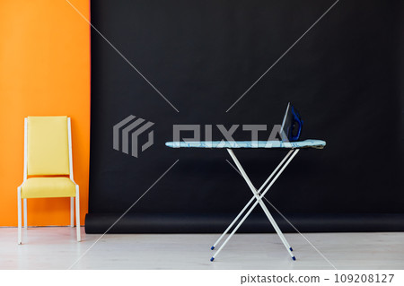 Room interior with ironing board and iron Room interior with ironing board and iron 109208127