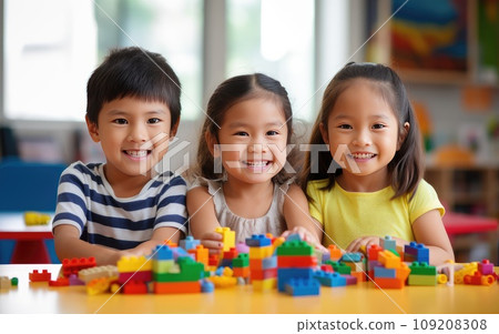 Three Children Building an Imaginative Lego Creation on a Colorful Table Three Children Building an Imaginative Lego Creation on a Colorful Table 109208308