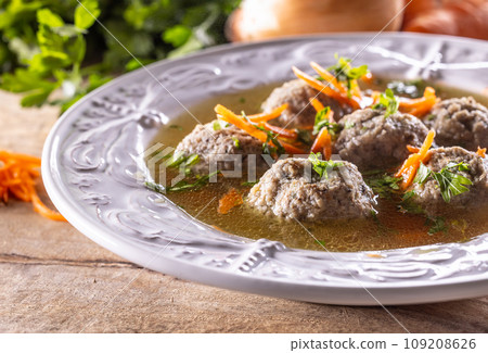 Broth with liver dumplings made from beef liver bread eggs and parsley cooked in beef broth. Broth with liver dumplings made from beef liver bread eggs and parsley cooked in beef broth. 109208626