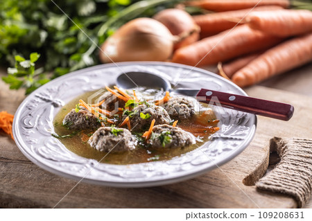 Broth with liver dumplings made from beef liver bread eggs and parsley cooked in beef broth. Broth with liver dumplings made from beef liver bread eggs and parsley cooked in beef broth. 109208631