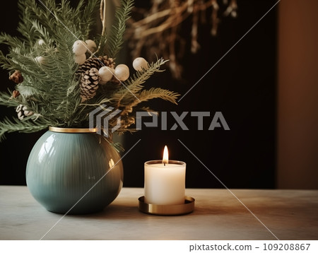 Decorative winter arrangement with fir and candles in cozy home interior, stylish room decor for Christmas holiday season, afternoon daylight 109208867
