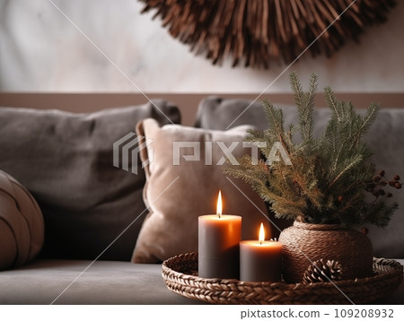 Decorative winter arrangement with fir and candles in cozy home interior, stylish room decor for Christmas holiday season, afternoon daylight 109208932