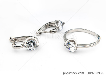 Silver jewels collection with crystals in minimalism style. Silver set of earrings and silver necklace 109208936