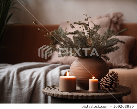 Decorative winter arrangement with fir and candles in cozy home interior, stylish room decor for Christmas holiday season, afternoon daylight Decorative winter arrangement with fir and candles in cozy home interior, stylish room decor for Christmas holiday season, afternoon daylight 109208980