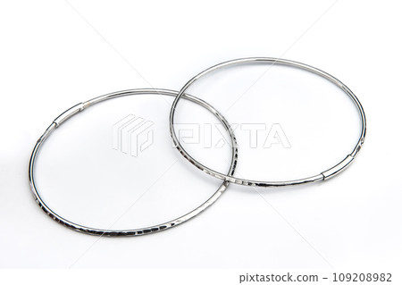 Luxury silver round earrings big jewelry for women isolated on white background, clipping path included Luxury silver round earrings big jewelry for women isolated on white background, clipping path included 109208982
