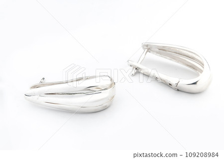 Luxury silver round earrings big jewelry for women isolated on white background, clipping path included Luxury silver round earrings big jewelry for women isolated on white background, clipping path included 109208984