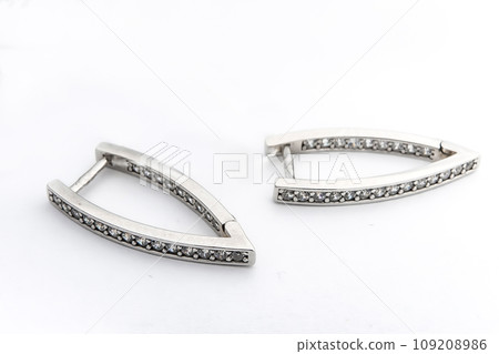Luxury silver round earrings big jewelry for women isolated on white background, clipping path included Luxury silver round earrings big jewelry for women isolated on white background, clipping path included 109208986