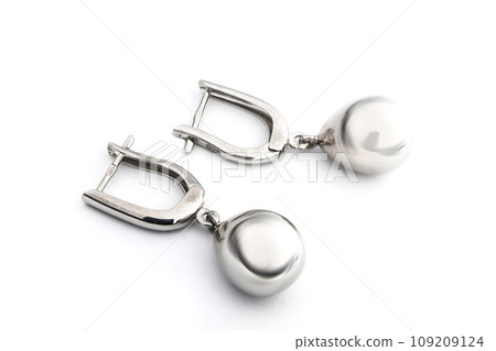 Luxury silver round earrings big jewelry for women isolated on white background, clipping path included Luxury silver round earrings big jewelry for women isolated on white background, clipping path included 109209124