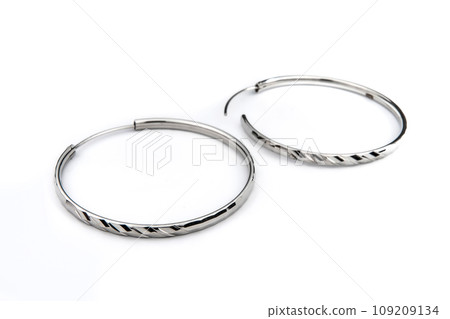 Luxury silver round earrings big jewelry for women isolated on white background, clipping path included Luxury silver round earrings big jewelry for women isolated on white background, clipping path included 109209134