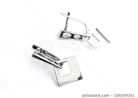 Luxury silver round earrings big jewelry for women isolated on white background, clipping path included Luxury silver round earrings big jewelry for women isolated on white background, clipping path included 109209161