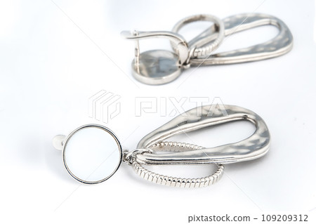 Luxury silver round earrings big jewelry for women isolated on white background, clipping path included 109209312
