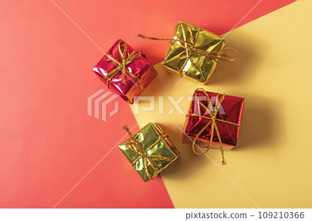 Gift boxes on a red and yellow background with copy space. Gift boxes on a red and yellow background with copy space. 109210366