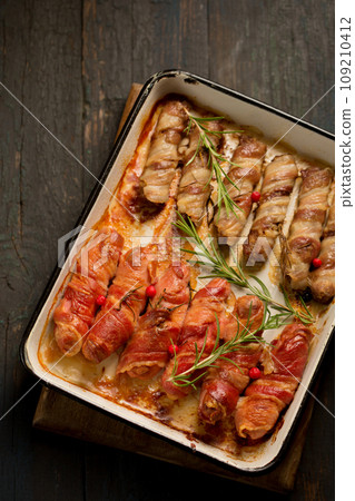 Traditional Christmas dish Sausages wrapped in bacon Traditional Christmas dish Sausages wrapped in bacon 109210412