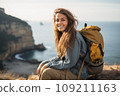 Beautiful young woman on a beach with backpack 109211163