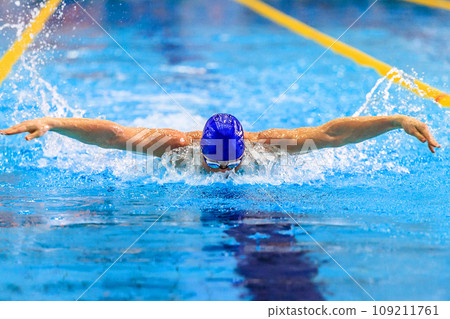 male swimmer swim butterfly stroke competition race, summer sports games 109211761