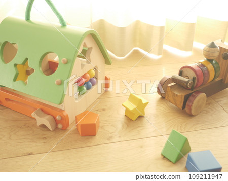 Bright living room and wooden toys Bright living room and wooden toys 109211947