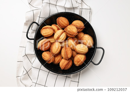 Nuts cookies on the table in a black bowl Nuts cookies on the table in a black bowl 109212037