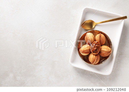 Cookies Nuts in a bowl on a light background 109212048