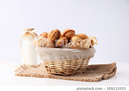 Nut cookies in a flying bowl on a white background 109212055