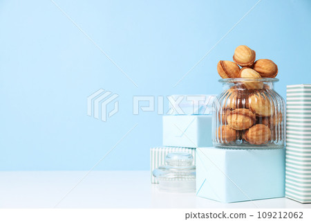 Cookies Nuts in a glass jar with gifts 109212062