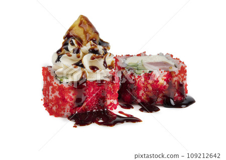 Cheap version of sushi rolls on a white background. Japanese food made from rice and artificial red caviar, eel and Philadelphia cheese topped with soy sauce. 109212642
