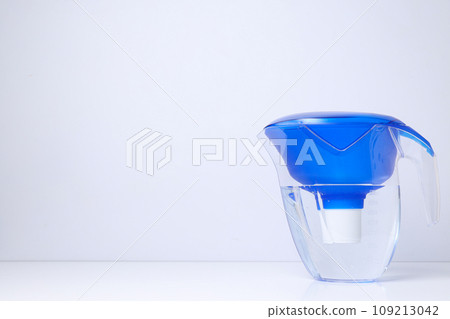 Water filter with a blue cap on a white background 109213042