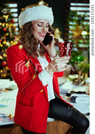 smiling elegant business woman speaking on smartphone 109215391