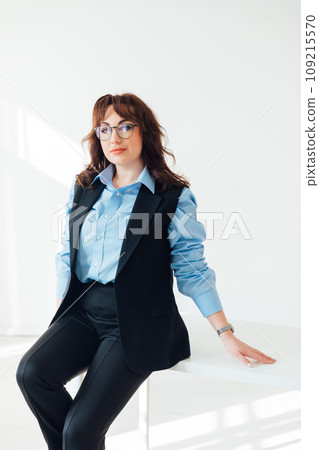 Woman teacher at the white table in the classroom office Woman teacher at the white table in the classroom office 109215570
