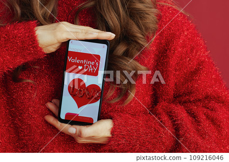 Closeup on woman in red sweater and beret Closeup on woman in red sweater and beret 109216046