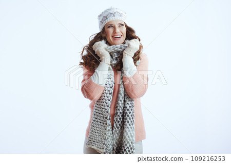 happy stylish woman in sweater, mittens, hat and scarf 109216253