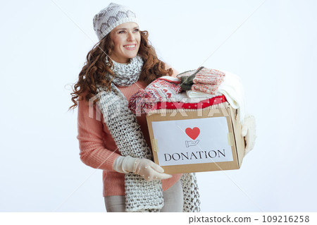 happy stylish woman in sweater, mittens, hat and scarf on happy stylish woman in sweater, mittens, hat and scarf on 109216258