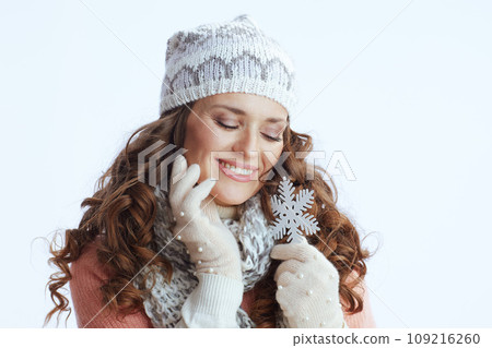 happy trendy woman in sweater, mittens, hat and scarf 109216260