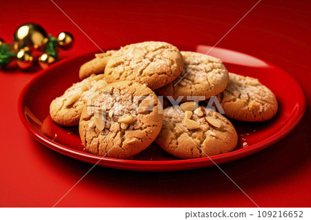 christmas cookies on a red plate on red background christmas cookies on a red plate on red background 109216652